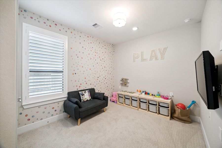 Third bedroom currently used as a children’s playroom.