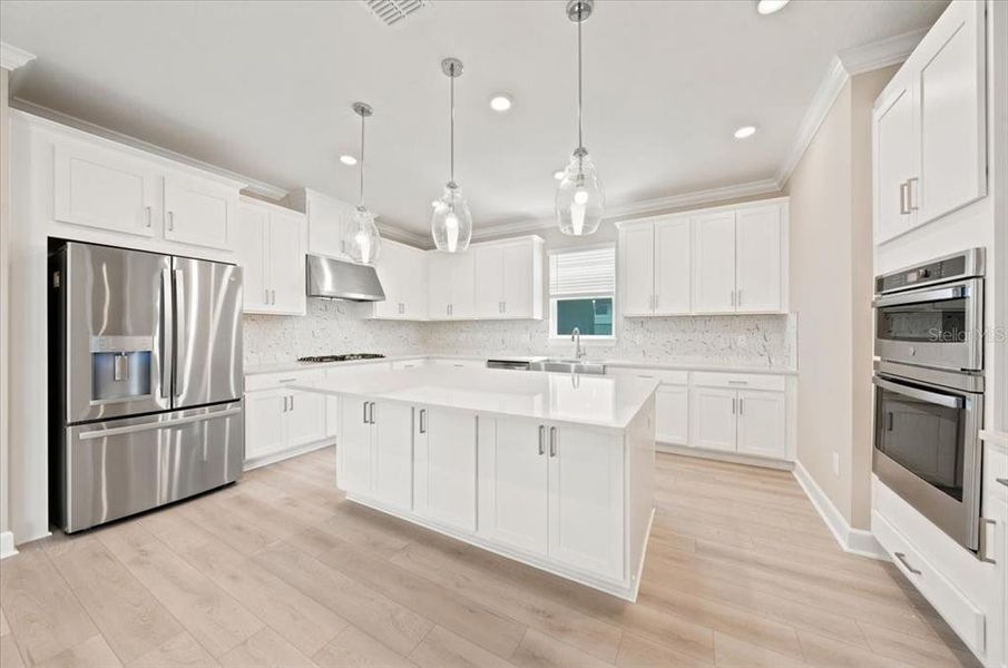 Furnished interior view inside a new home in Coasterra Community Group Page, Palmetto (Image 8).