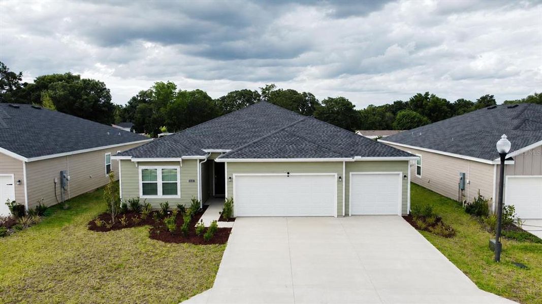 Front exterior of a new home in Pioneer Ranch, Ocala, FL, highlighting curb appeal (Image 2). Front exterior of a new home in Pioneer Ranch, Ocala, FL, highlighting curb appeal (Image 2).