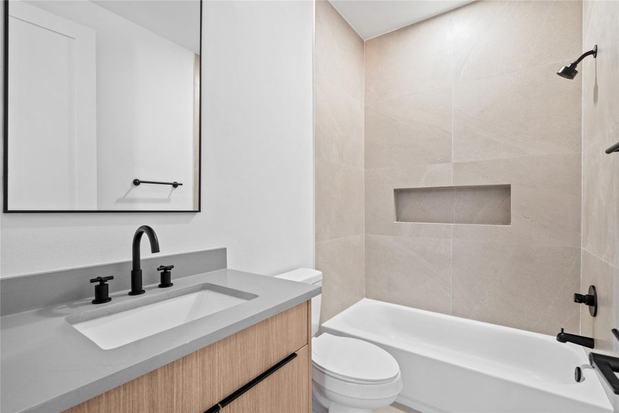 The secondary ensuite offers its own sense of polish, featuring full-height tile & a streamlined niche for essentials. The secondary ensuite offers its own sense of polish, featuring full-height tile & a streamlined niche for essentials.