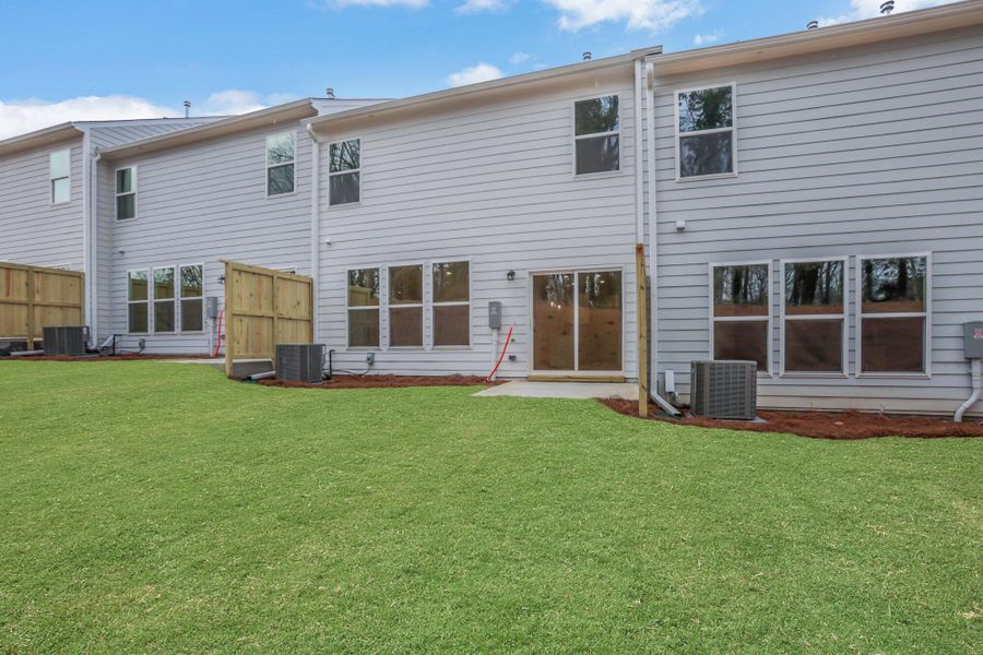 Exterior details and patio area of a home in Villas at Dawsonville Townhomes, Dawsonville (Image 4).