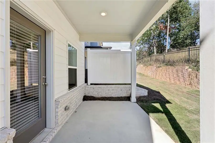 Exterior details and patio area of a home in Eastlyn Crossing, Flowery Branch (Image 3).