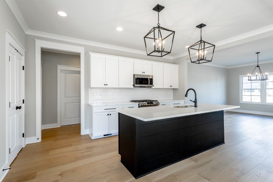 Representative furnished interior of a home built from the Carolina A by Riverstone Construction, LLC in Creekside, Cleveland (Image 11).
