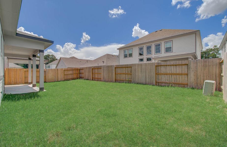 Exterior details and patio area of a home in Harmony Cove, Humble (Image 26).