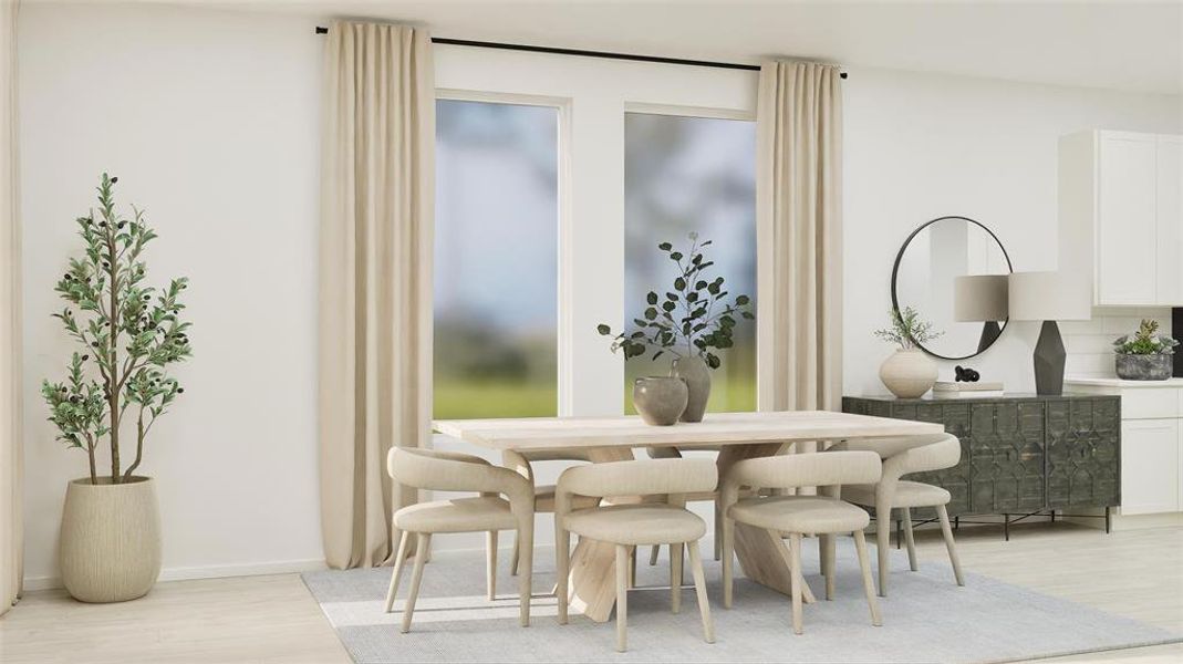 Dining room with light wood finished floors and baseboards Dining room with light wood finished floors and baseboards