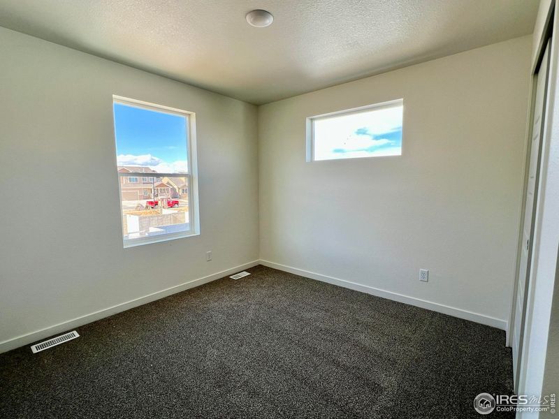 Spacious, unfurnished interior of a new home in Union Colony West, Greeley (Image 19).