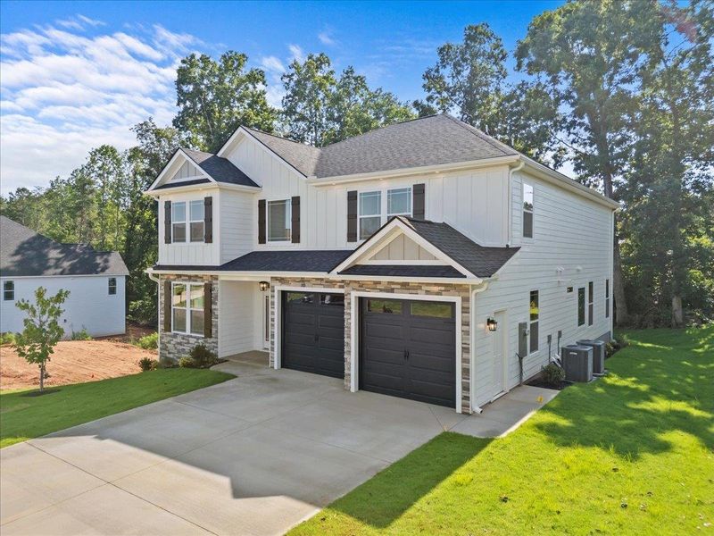 Front exterior of a new home in Lakeside at Blue Ridge Plantation, Taylors, SC, highlighting curb appeal (Image 22).