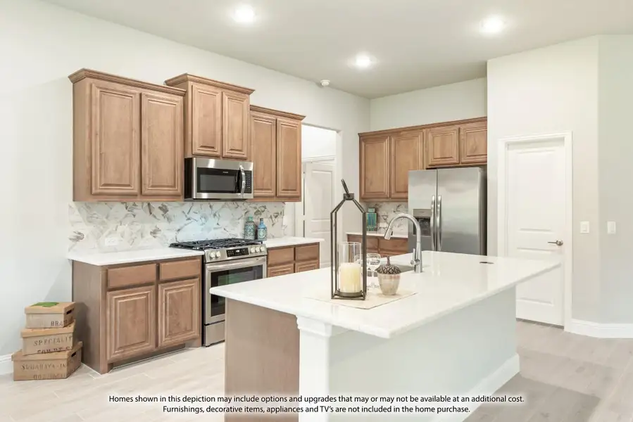 Kitchen with medium wood cabinets, marble tile backsplash, stainless steel appliances, and center island with white countertop Kitchen with medium wood cabinets, marble tile backsplash, stainless steel appliances, and center island with white countertop