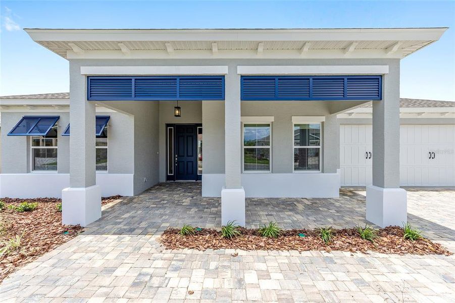 Exterior details and patio area of a home in On Top of the World Communities, Ocala (Image 4).