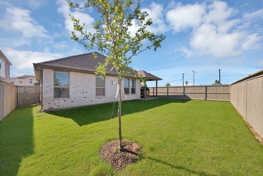 Exterior details and patio area of a home in Pecan Square, Northlake (Image 3).