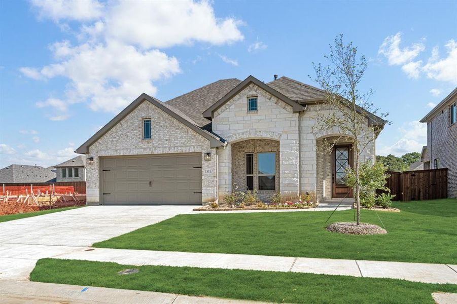 Front exterior of a new home in Woodstone, Providence Village, TX, highlighting curb appeal (Image 21). Front exterior of a new home in Woodstone, Providence Village, TX, highlighting curb appeal (Image 21).