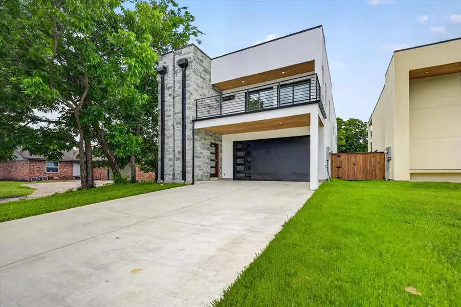 Front exterior of a new home in , Irving, TX, highlighting curb appeal (Image 17). Front exterior of a new home in , Irving, TX, highlighting curb appeal (Image 17).