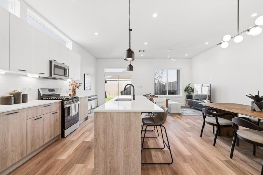 Intentional spacing between the island and cabinetry creates a kitchen that flows effortlessly.