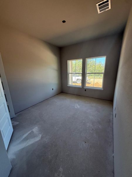 Spare room with concrete floors