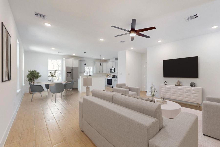 Living area featuring ceiling fan, recessed lighting, and wood finish floors