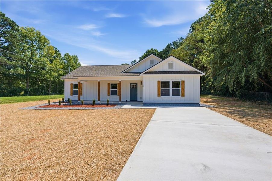 Front exterior of a new home in , Dallas, GA, highlighting curb appeal (Image 17). Front exterior of a new home in , Dallas, GA, highlighting curb appeal (Image 17).