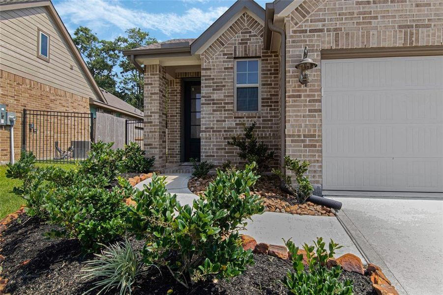 Front yard entrance w/ lovely landscaping