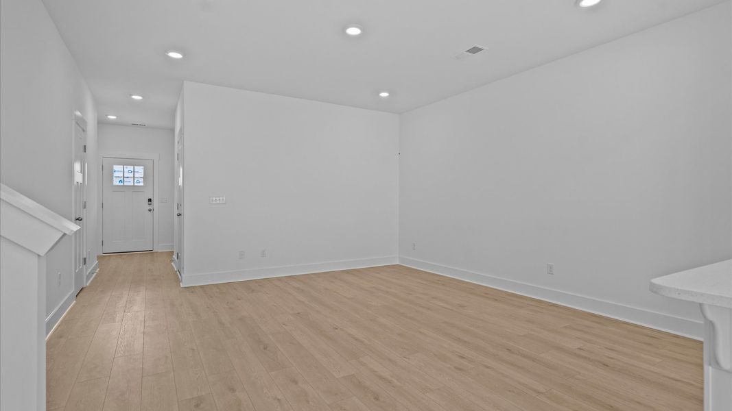 Exceptional family space with hardwood floors and seamless flow to dining and kitchen areas Exceptional family space with hardwood floors and seamless flow to dining and kitchen areas