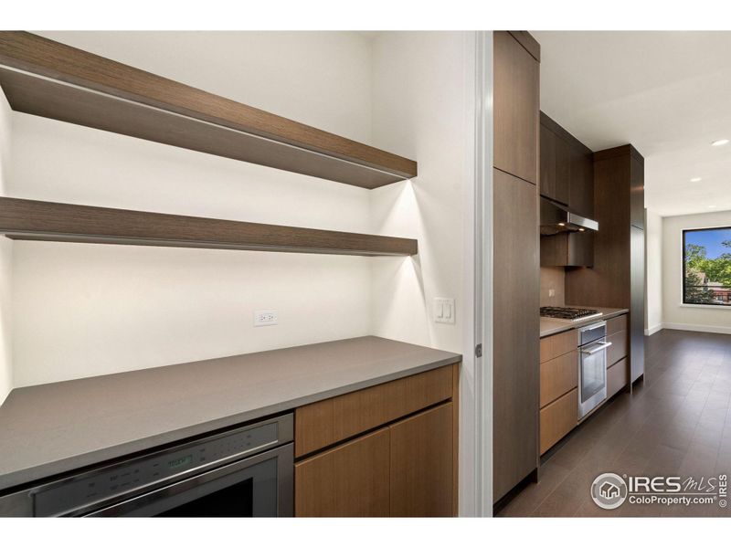 Under-cabinet lighting channels make for a beautiful ambiance throughout the kitchen and pantry.