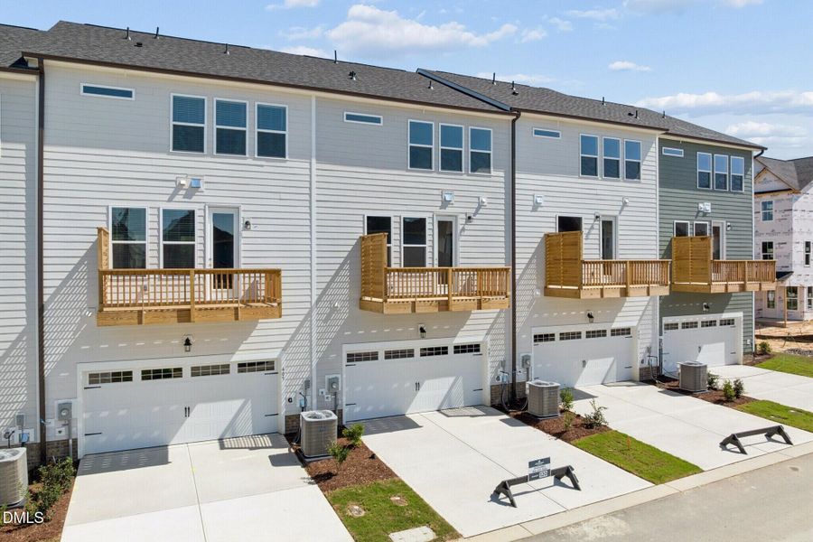 Front exterior of a new home in Forestville Yard Townhomes, Knightdale, NC, highlighting curb appeal (Image 16).