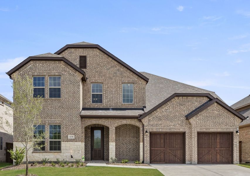 Representative exterior photo of a completed home built from the Kirby by UnionMain Homes in Edgewater, Fate, TX (Image 1). Representative exterior photo of a completed home built from the Kirby by UnionMain Homes in Edgewater, Fate, TX (Image 1).
