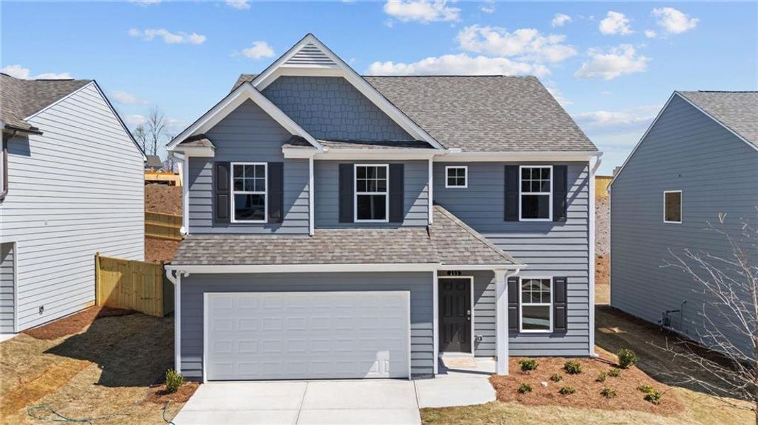 Front exterior of a new home in The Reserve at Willow Oaks, Canton, GA, highlighting curb appeal (Image 1). Front exterior of a new home in The Reserve at Willow Oaks, Canton, GA, highlighting curb appeal (Image 1).