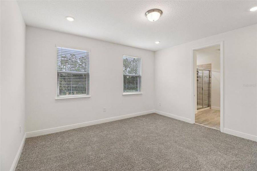 Spacious, unfurnished interior of a new home in Legends Preserve - Signature Series, Daytona Beach (Image 29).