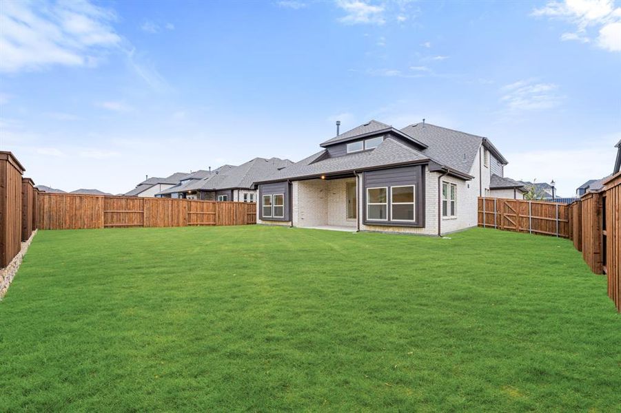 Exterior details and patio area of a home in Windsong Ranch Classic 61, Prosper (Image 23).