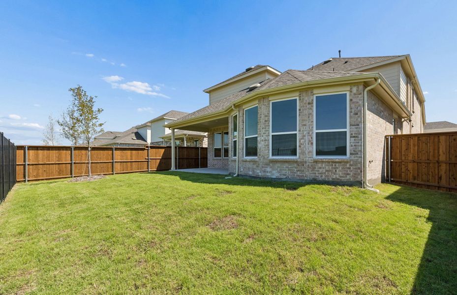 Exterior details and patio area of a home in Creekview Meadows, Pilot Point (Image 2).