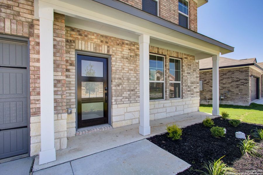 Front exterior of a new home in Comanche Ridge, San Antonio, TX, highlighting curb appeal (Image 42).