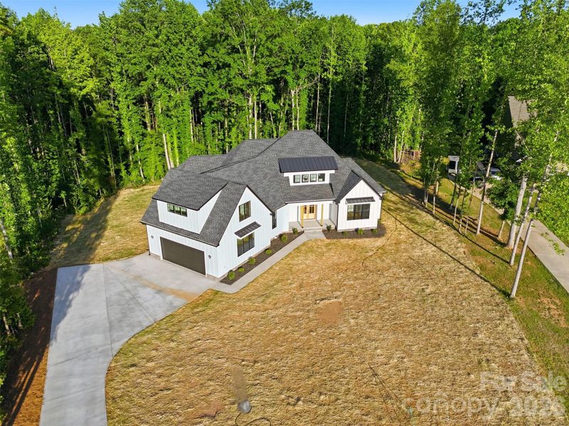 Front exterior of a new home in , Clover, SC, highlighting curb appeal (Image 26). Front exterior of a new home in , Clover, SC, highlighting curb appeal (Image 26).