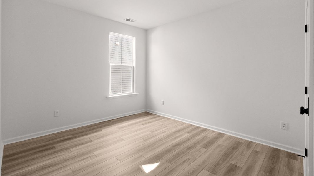 Bedroom 3 in the Easton plan offers a versatile space with natural light and clean finishes.