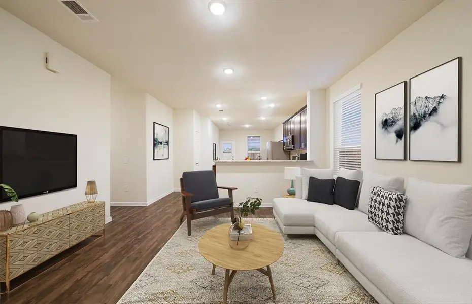 *Model Representation - Spacious gathering room with large windows