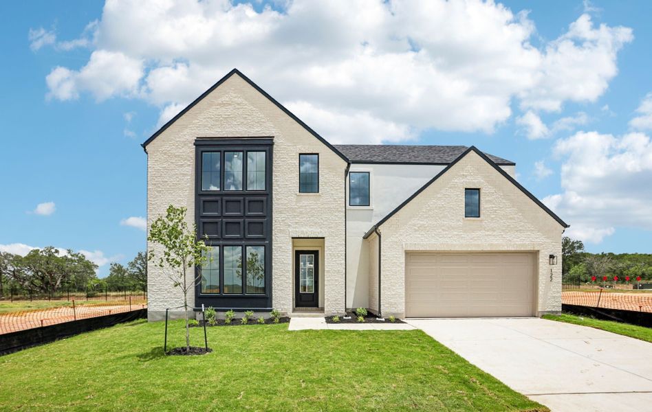 Front exterior of a new home in Freedom at Anthem, Kyle, TX, highlighting curb appeal (Image 1). Front exterior of a new home in Freedom at Anthem, Kyle, TX, highlighting curb appeal (Image 1).
