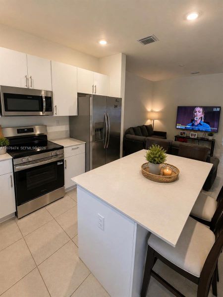 Furnished interior view inside a new home in , Homestead (Image 3). Furnished interior view inside a new home in , Homestead (Image 3).
