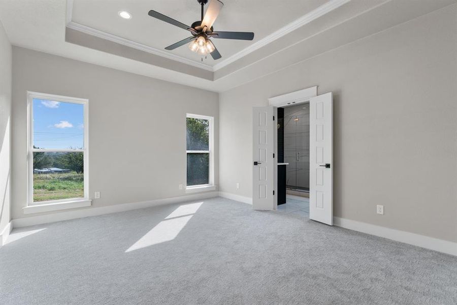 Full bath with a shower stall, two vanities, tile patterned floors, and a walk in closet