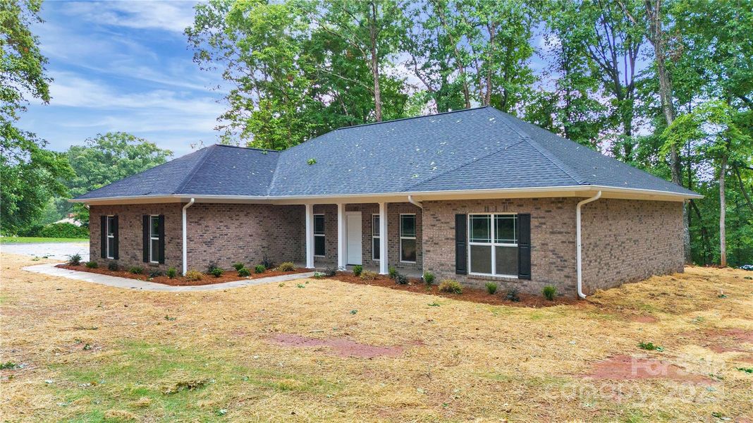 Front exterior of a new home in , Mocksville, NC, highlighting curb appeal (Image 22).