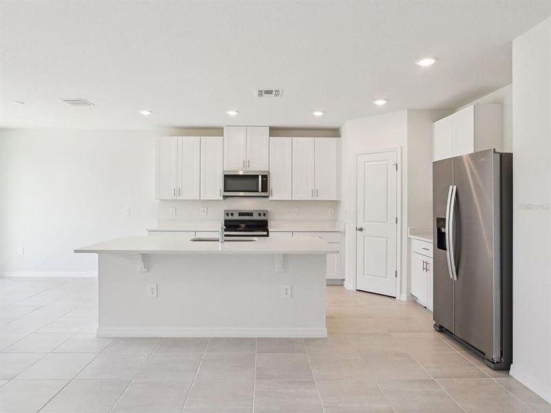 Furnished interior view inside a new home in The Reserve at Van Oaks, Auburndale (Image 6).