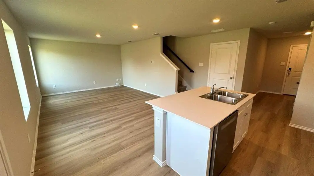Kitchen opening to Living