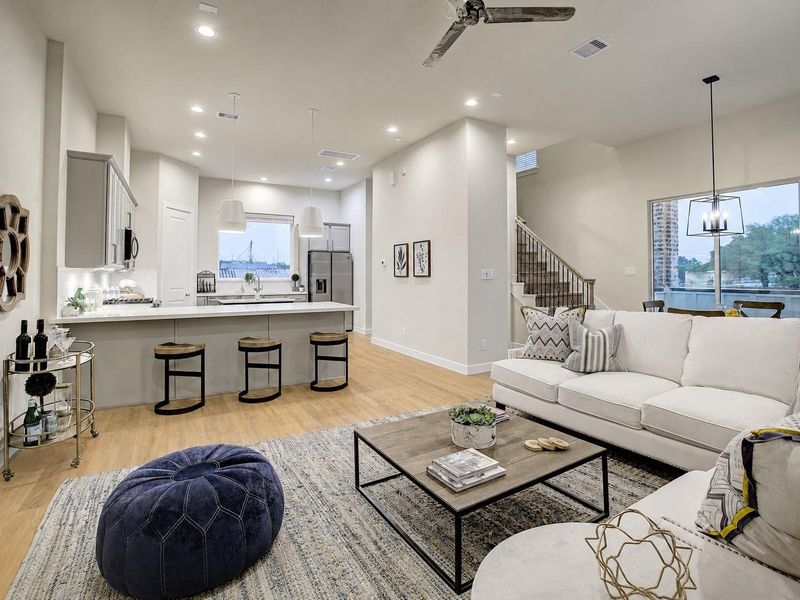 Fluid main floor gathering hub — expansive quartz island with casual stool seating, stylish pendant drops, and effortless connection to the main living lounge. Fluid main floor gathering hub — expansive quartz island with casual stool seating, stylish pendant drops, and effortless connection to the main living lounge.