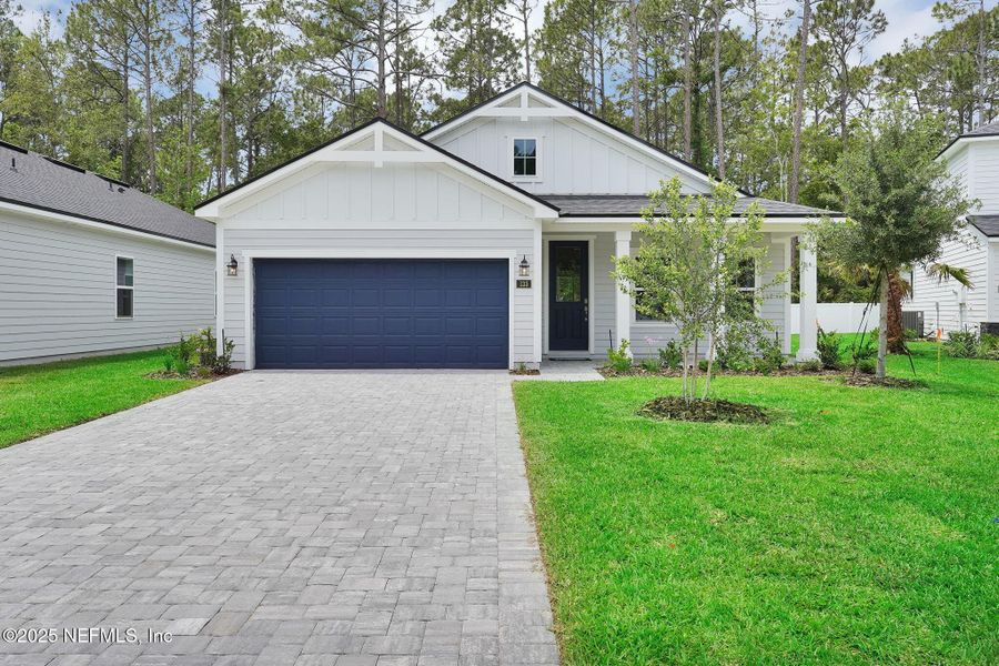Front exterior of a new home in Landing at Olde Florida, St. Augustine, FL, highlighting curb appeal (Image 2).