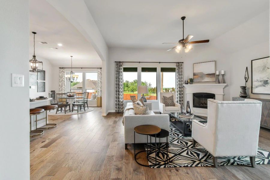 Family Room to Nook | Concept 2434 at Coyote Crossing in Godley, TX by Landsea Homes