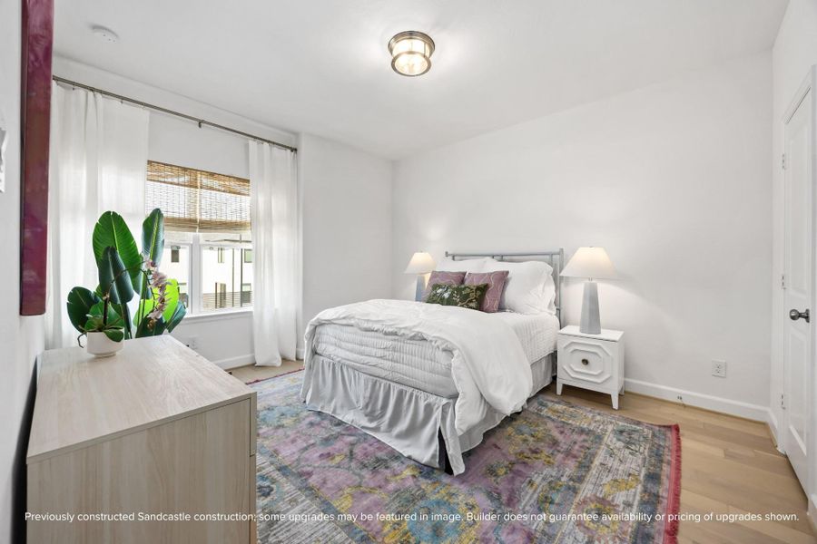 Serene, sunlit, and stylish—this secondary bedroom adapts beautifully to your needs, whether guest space, nursery, or creative escape.