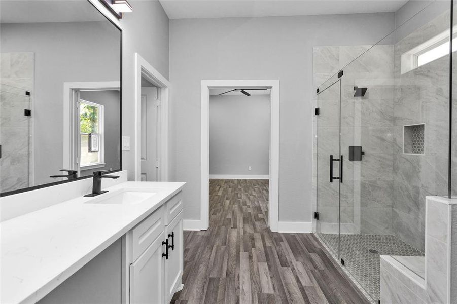 Another view of your primary bath. Notice dressing area between double sinks.