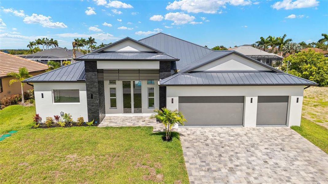 Front exterior of a new home in , Cape Coral, FL, highlighting curb appeal (Image 33). Front exterior of a new home in , Cape Coral, FL, highlighting curb appeal (Image 33).