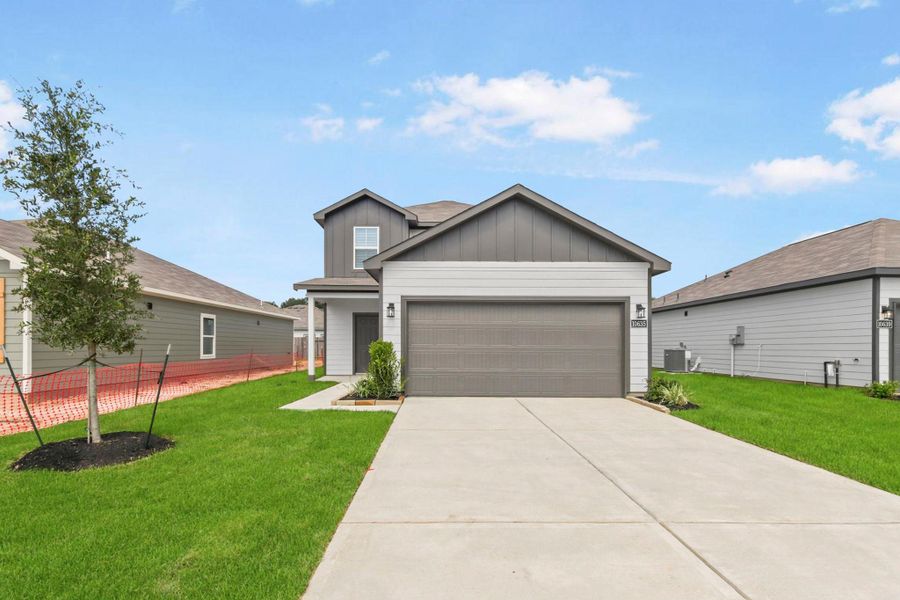 Front exterior of a new home in Crockett Meadows, Conroe, TX, highlighting curb appeal (Image 1). Front exterior of a new home in Crockett Meadows, Conroe, TX, highlighting curb appeal (Image 1).