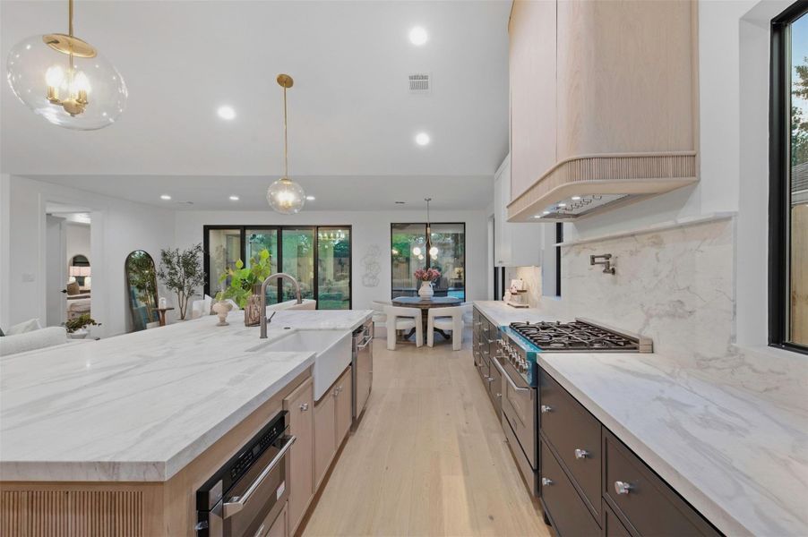 Professional-style ZLINE appliances complete the kitchen with a sleek, high-end finish.