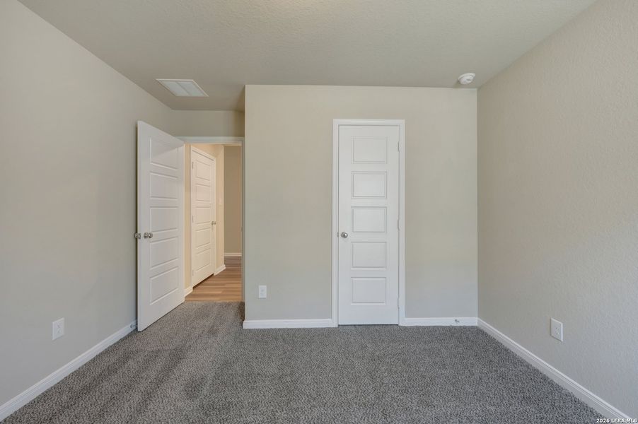 Spacious, unfurnished interior of a new home in Hunters Ranch, San Antonio (Image 13).