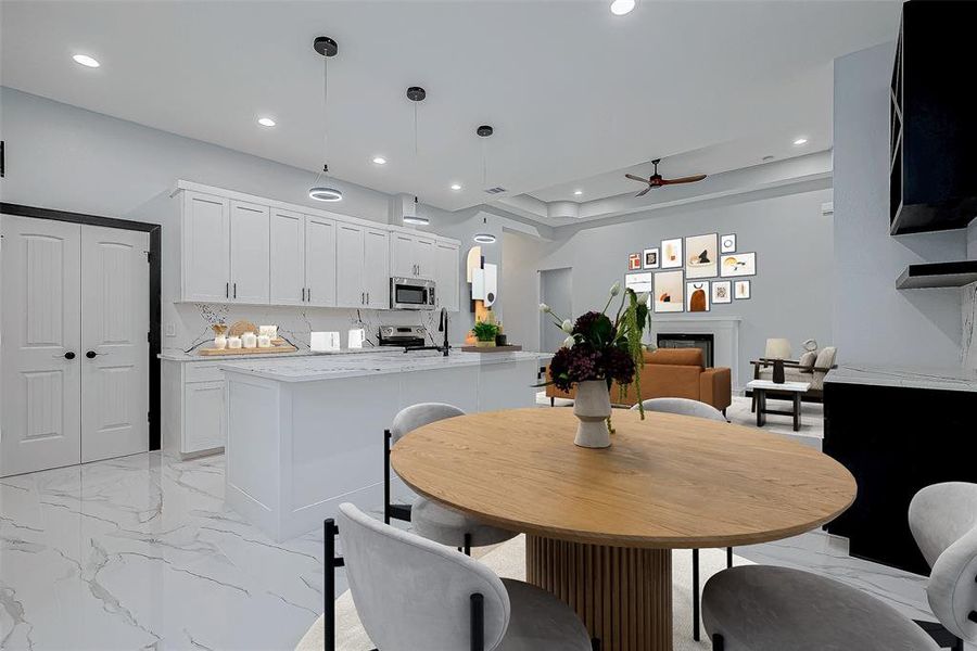 The kitchen includes a cozy dry wine bar, ideal for entertaining guests, along with a dedicated space for a breakfast table to enjoy casual meals.