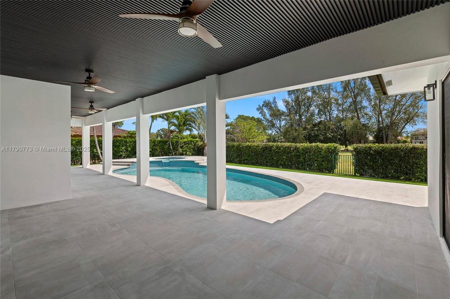 Expansive covered patio offers the perfect setting for poolside gatherings, al fresco dining, and relaxing afternoons. Expansive covered patio offers the perfect setting for poolside gatherings, al fresco dining, and relaxing afternoons.